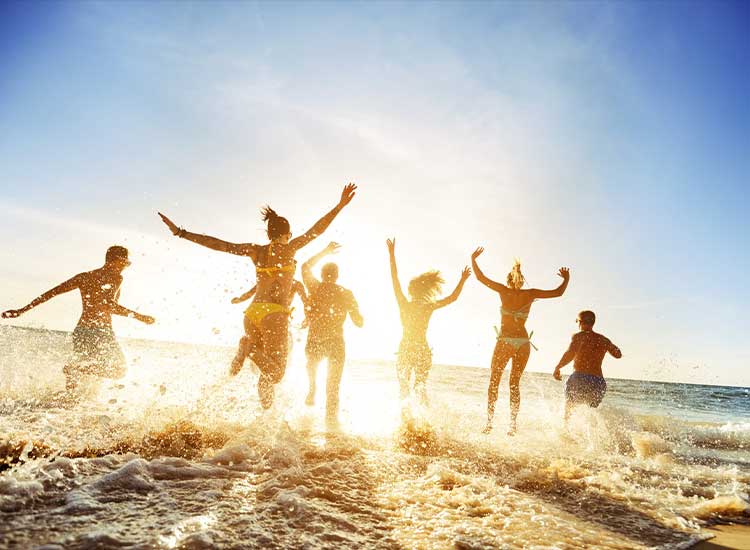 Group of people running in the beach